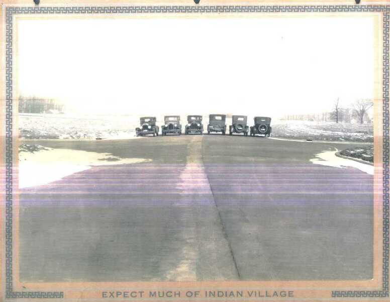 Automobiles lined up on the wide Indian Village boulevard, c. 1927